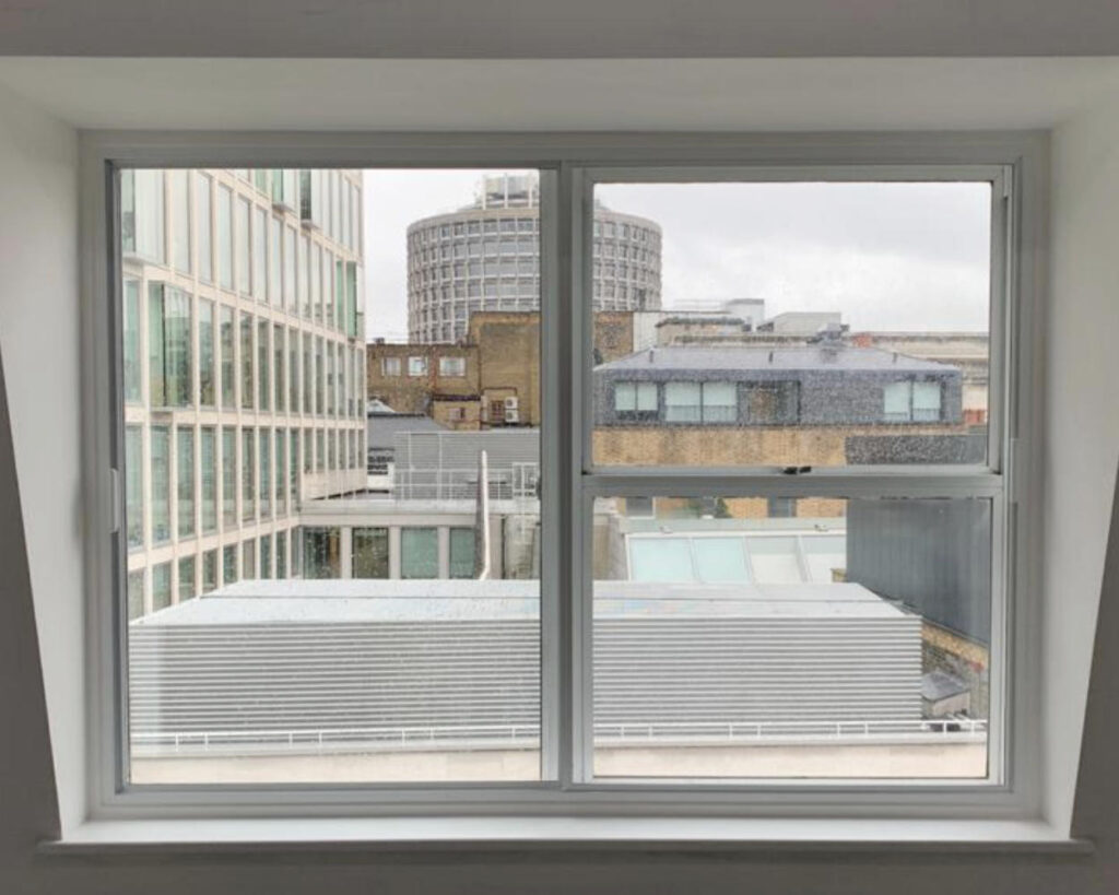 Horizontal sliding secondary glazing