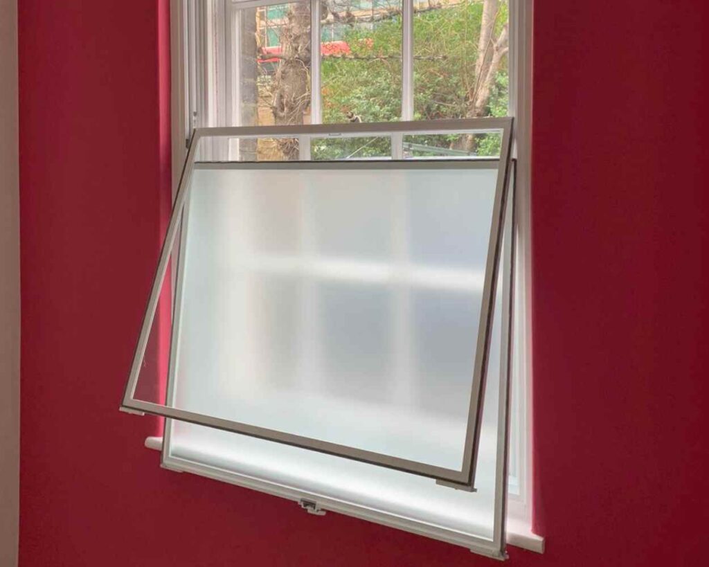 Vertical sliding secondary Glazing